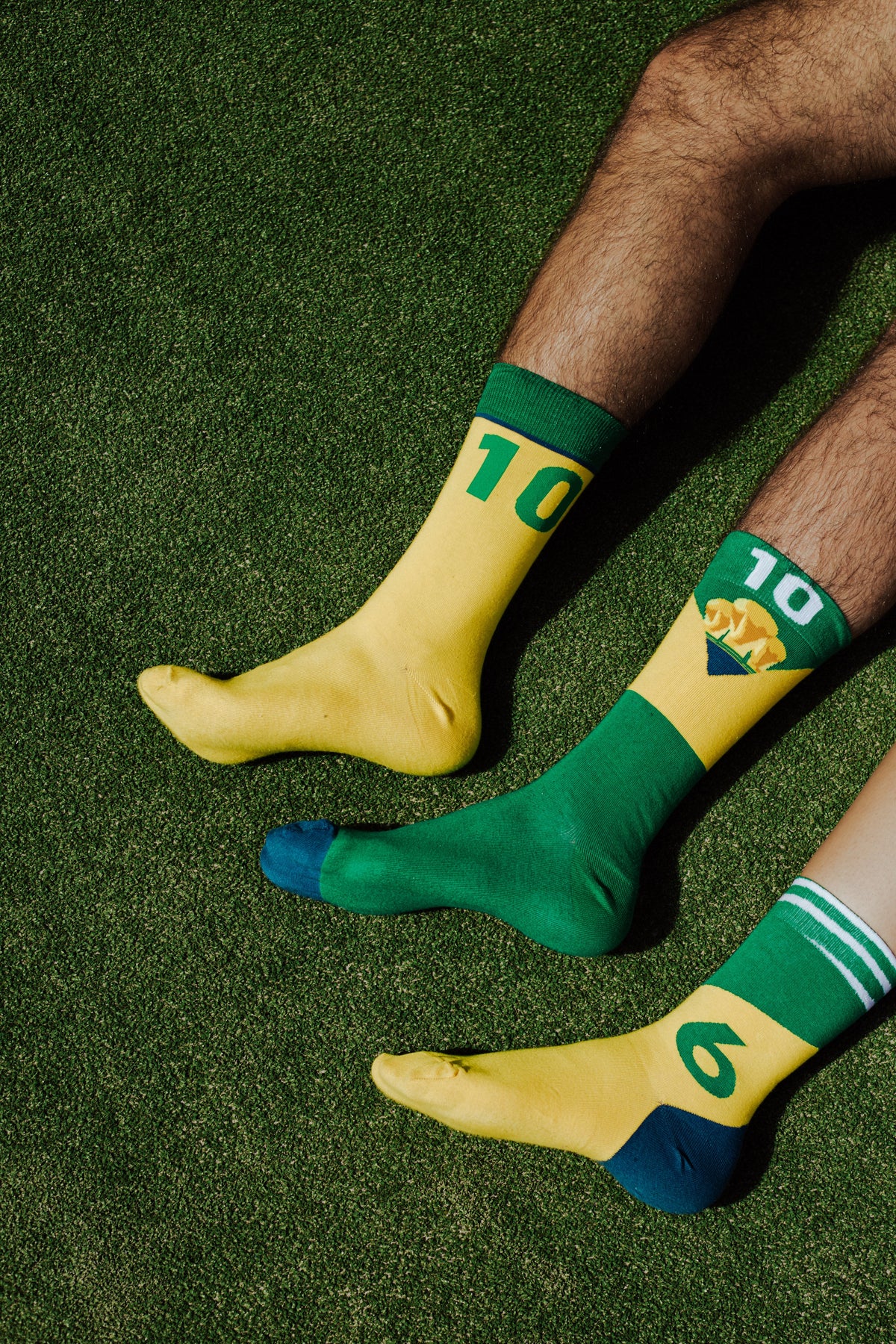 Memoraball socks celebrating Pelé's legacy with vibrant yellow, green and blue Brazilian colors